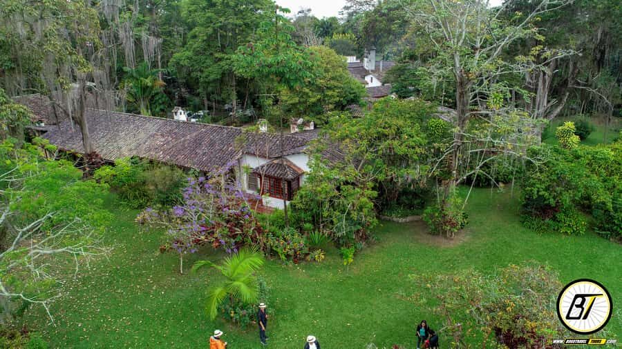 Bogotá: Guided Coffee Tour with Lunch, and Pickup & Drop-Off - Entering Coloma: finca gardens and a working coffee estate