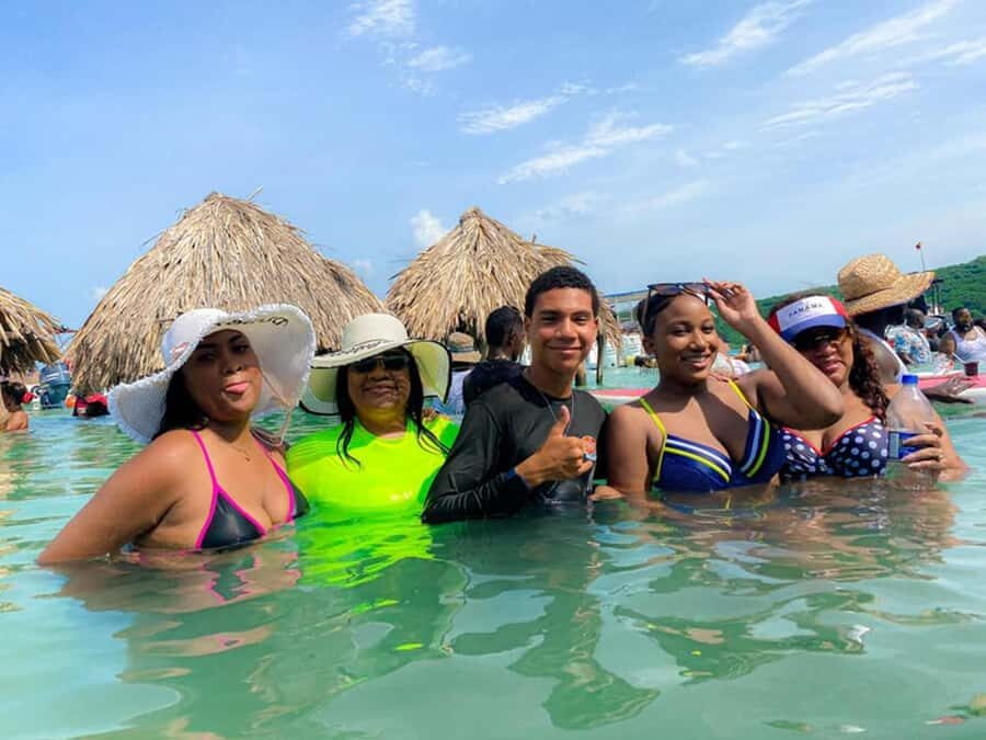 Cartagena: 4 Island Day Trip by Boat and Caribbean Lunch - Cholón: Caribbean Party Energy With Crowds and Sales Pressure