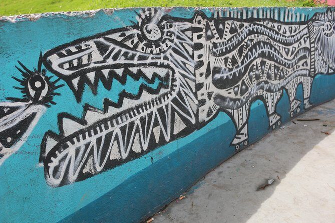 Graffiti Tour in La Candelaria Bogotá with Transportation - The narrow street of indigenous ancestry: where the walls get specific
