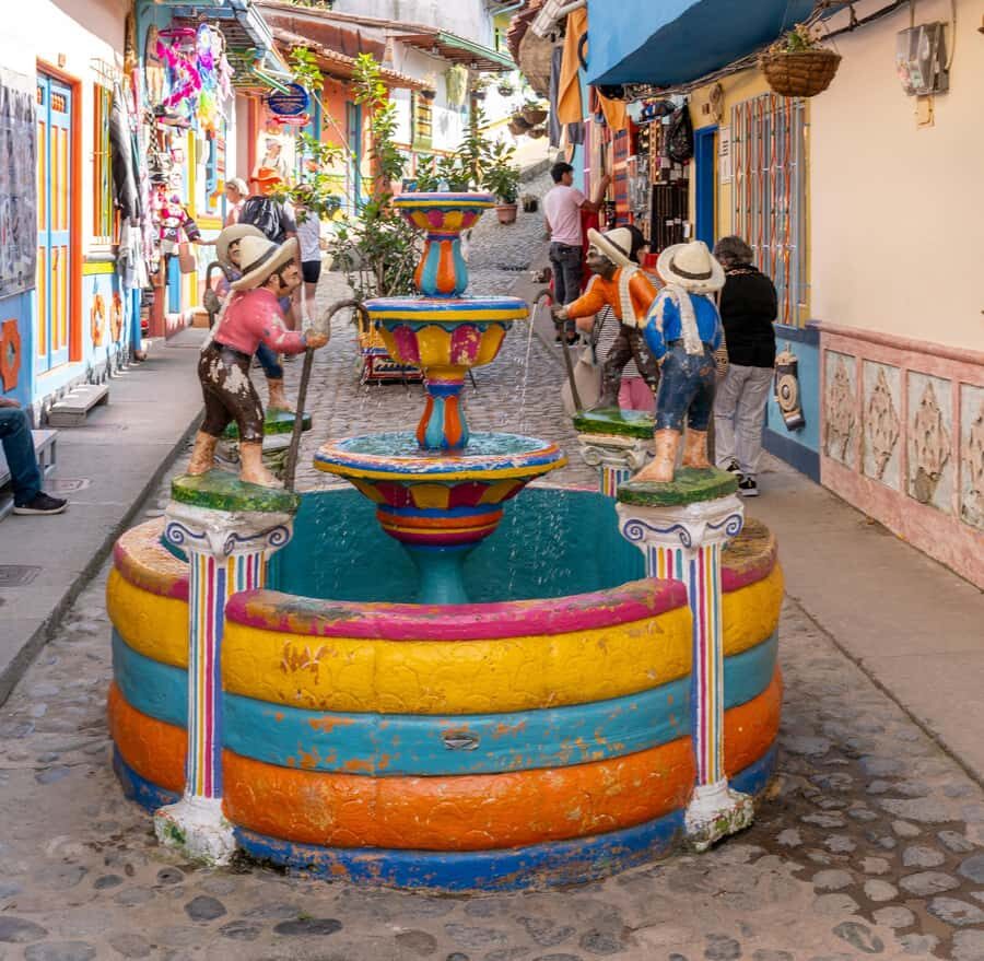 Guatapé Tour by Chiva + Visit to Pablo Escobar's Hacienda - Guatapé town: colorful streets, umbrellas, and relaxed photo time