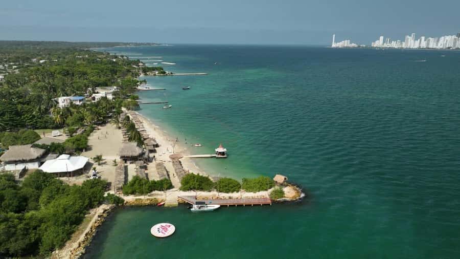 Isla Tierra Bomba beach club: Day Pass with typical food - Fenix Beach Club setup: beds, shade, pool, and volleyball