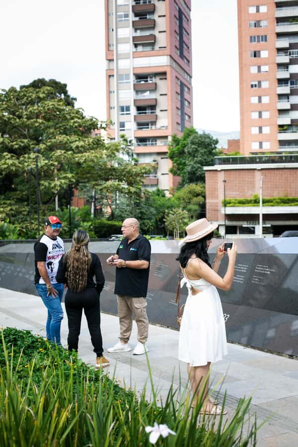 Medellín: Pablo Escobar Tour incl. museum & transportation - Medellín street stop: offices, public works, and the Monaco building link