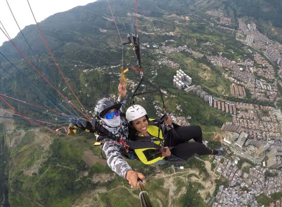 Paragliding Medellin with Transportation and free Videos - Over Medellín and Bello: 360º Views, Air Tricks, and GoPro Media